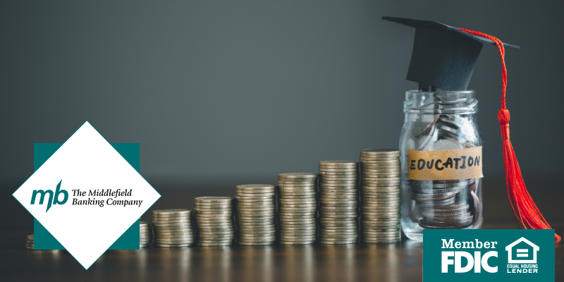Coins stacked up in ascending order with a jar full of joins that says Graduation on tab and has a graduation cap resting on it