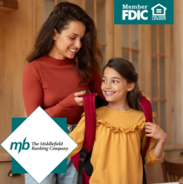 Mom helping daughter put on her backpack